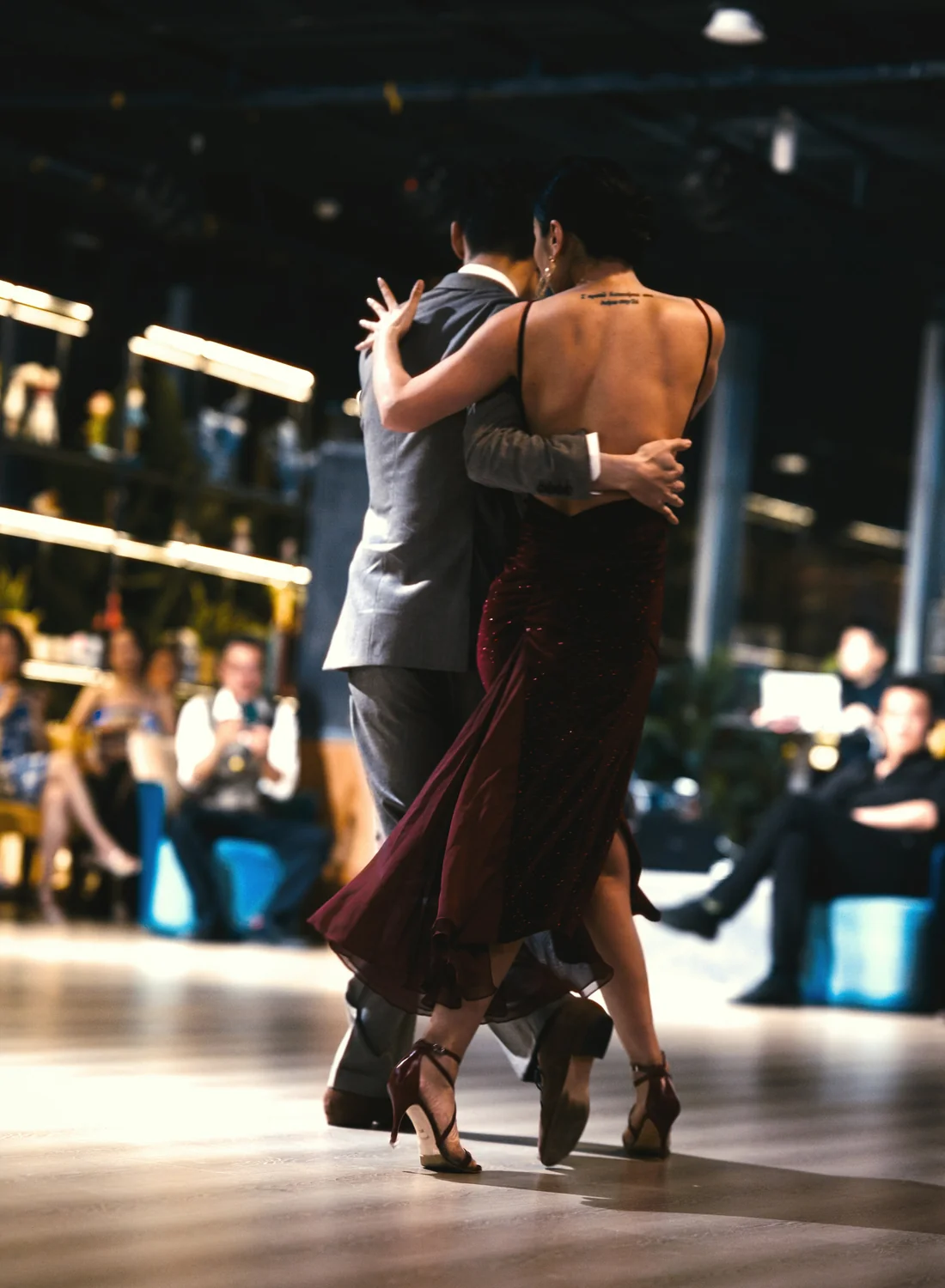 A tango couple dancing in close embrace, full length, representative of the couples in Tango Porteño's cast